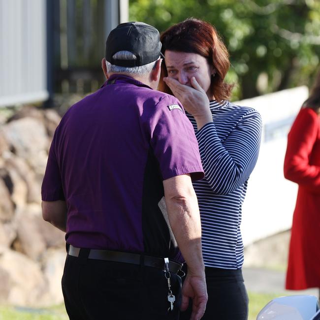 A distraught woman arrives at the scene of the alleged murder in Newmarket. Picture: Tara Croser.