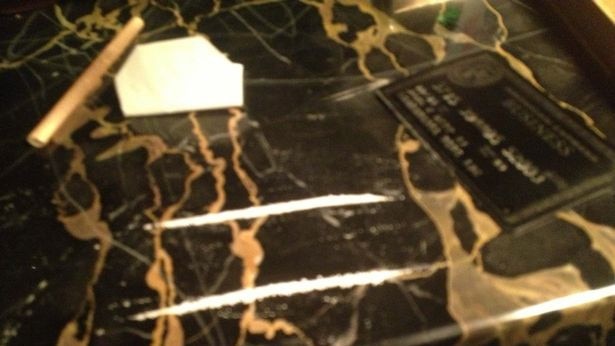 Photos supplied by Amber Heard to the UK court purporting to show lines of cocaine on a table that were allegedly taken by Depp.