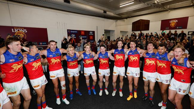 The Lions belt out the team song after the thrilling win. (Photo by Dylan Burns/AFL Photos via Getty Images)