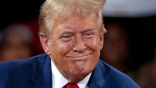 Former US President and Republican presidential candidate Donald Trump attends a town hall meeting moderated by Arkansas Governor Sarah Huckabee Sanders at the Dort Financial Center in Flint, Michigan, on September 17, 2024. (Photo by JEFF KOWALSKY / AFP)