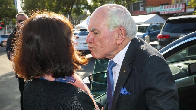 Former prime minister John Howard greets Chisholm Liberal MP Gladys Liu on Kingsway in Glen Waverley, Melbourne. Picture: Ian Currie