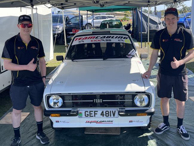 Mechanics Tyler and Caden Broughton in front of their #46 Huxton MotorsportFord Escort at Gympie Racecourse, July 20, 2023.