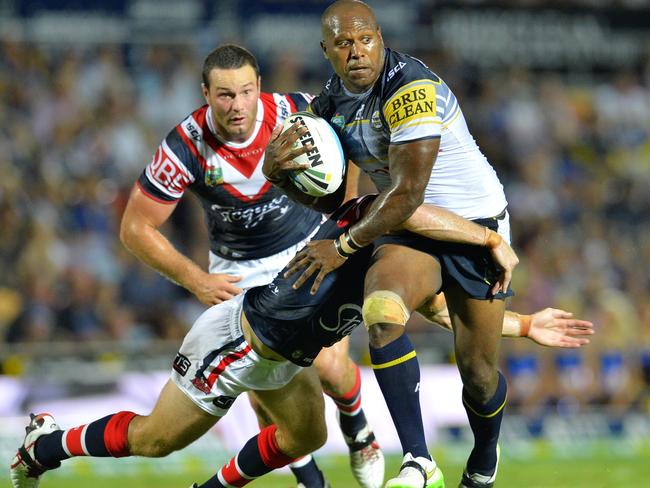 Cowboys' Robert Lui with Roosters' tackled by Shaun Kenny-Dowell and Boyd Cordner in hot pursuit in the Round 1 match of the 2015 NRL season. Picture: Wesley Monts