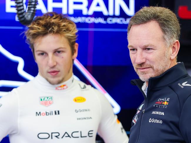 BAHRAIN, BAHRAIN - FEBRUARY 26: Christian Horner, Team Principal of Oracle Red Bull Racing and Liam Lawson of New Zealand and Oracle Red Bull Racing look on in the garage during day one of F1 Testing at Bahrain International Circuit on February 26, 2025 in Bahrain, Bahrain. (Photo by Mark Thompson/Getty Images)