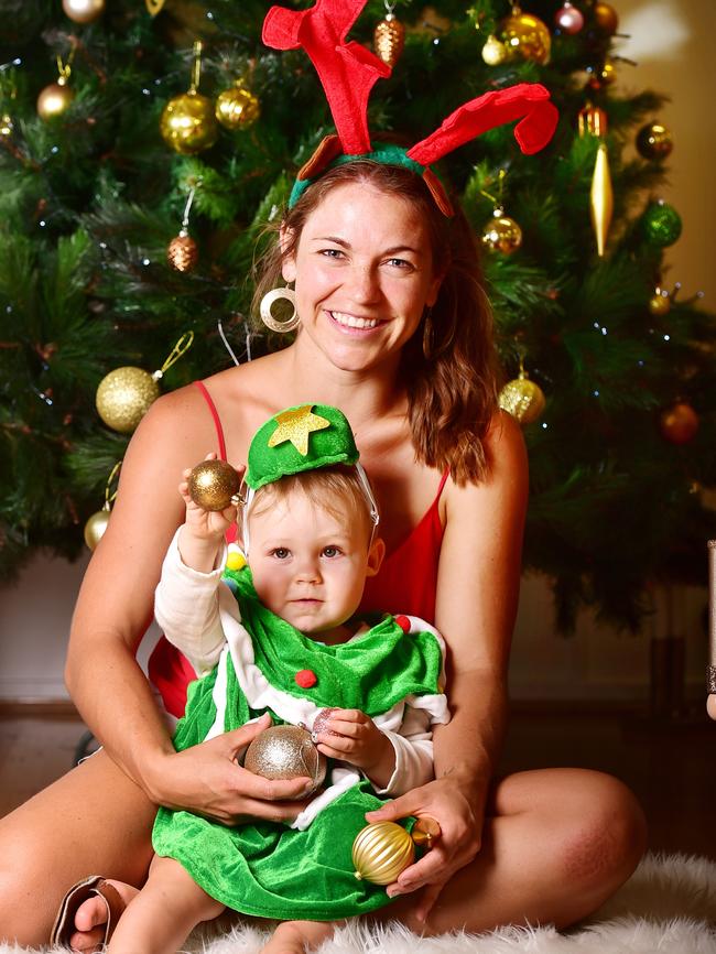 Kate Tilse with her daughter Leilani, 1, at Geckos Family Centre on Lavarack Barracks celebrating Christmas. Picture: Shae Beplate.