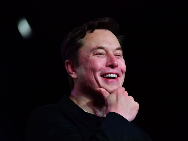 In this file photo taken on March 14, 2019 Tesla CEO Elon Musk reacts during the unveiling of the new Tesla Model Y in Hawthorne, California. (Photo by Frederic J. BROWN / AFP)