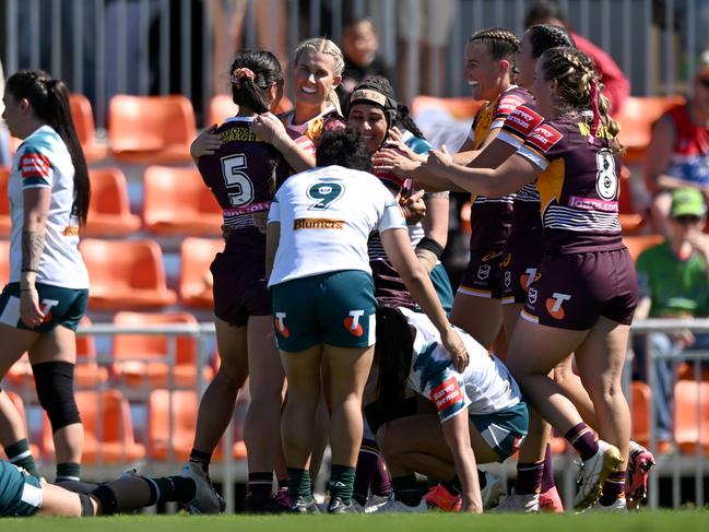 The Broncos celebrate a Stacey Waaka try.