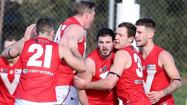 Rooster Ben Jarman (centre) celebrates his goal with team mates. Picture: Sarah Reed