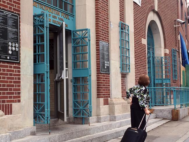 A woman leaves the Metropolitan Pool in the Williamsburg neighbourhood in the Brooklyn borough of New York. Picture: Rachelle Blidner