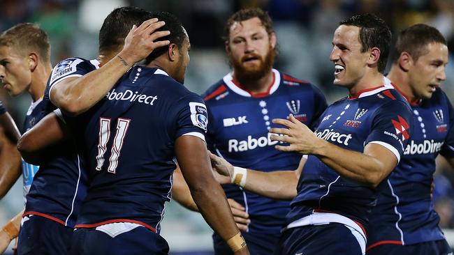 CANBERRA, AUSTRALIA - APRIL 18: Sefanaia Naivalu of the Rebels is congratulated after scoring a try during the round 10 Super Rugby match between the Brumbies and the Rebels at GIO Stadium on April 18, 2015 in Canberra, Australia. (Photo by Stefan Postles/Getty Images)