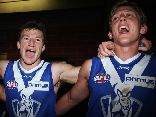 Brent Harvey and Daniel Harris enjoy singing North Melbourne’s song. 