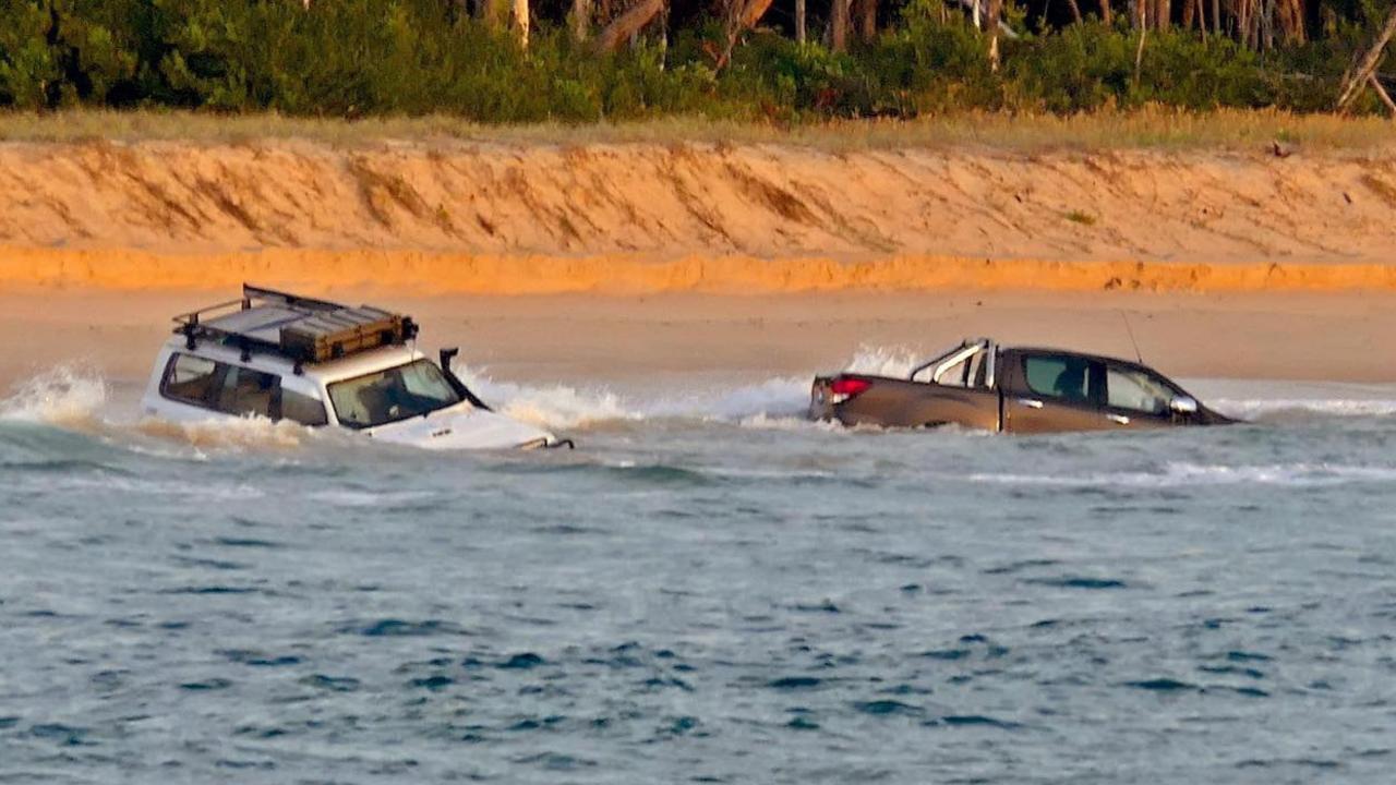 Two 4WDs were pulled out of the water at Teewah Beach on the weekend. Pictures: Clayton's Towing