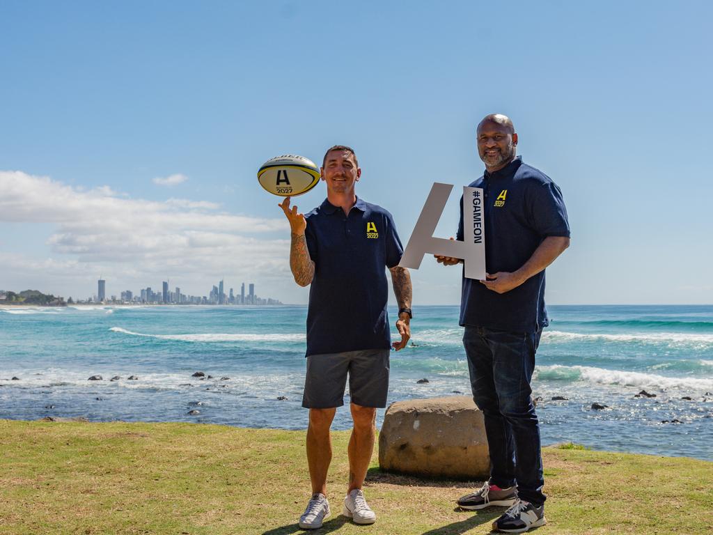 Former Wallabies Mat Rogers (left) and Lote Tuqiri enjoy the Gold Coast sun ahead of Australia’s Test against South Africa on Sunday at Cbus Super Stadium. Picture: Stephen Tremain