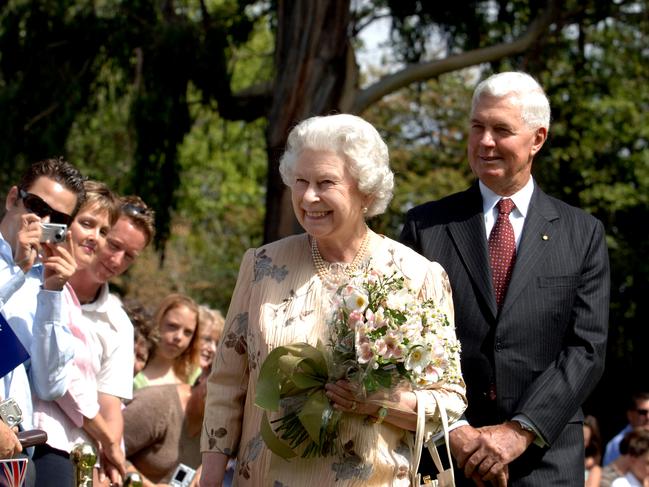 Her Majesty Queen Elizabeth II and Governor-General Major-General Michael Jeffery make their way through the crowd after tree planting ceremony on the lawns of Government House Yaralumla in Canberra.
