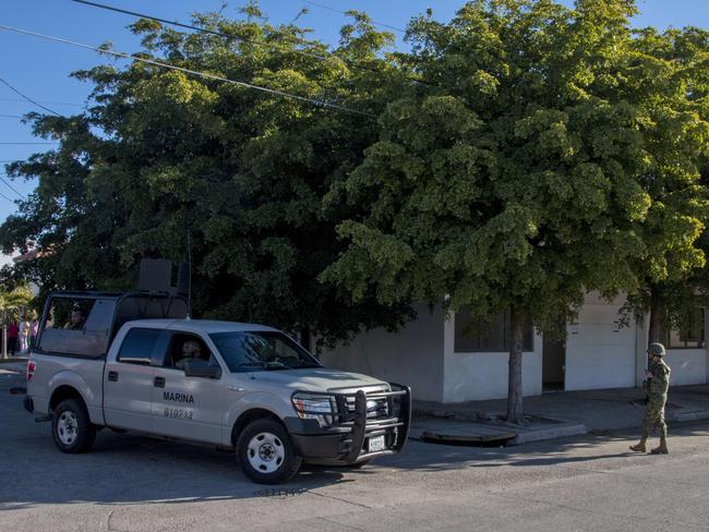 Where he was ... Marines stands guard in front of the house where five gang suspects were killed in the military operation which resulted in the recapture of Joaquin "El Chapo" Guzman in the city of Los Mochis, Sinaloa State, Mexico. Picture: AFP