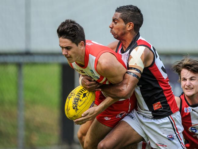 Southern Districts' Charles McAdam tackles Waratah's Brodie Carroll in Sunday's NTFL Premier League match at Gardens Oval.; Picture: FELICITY ELLIOTT