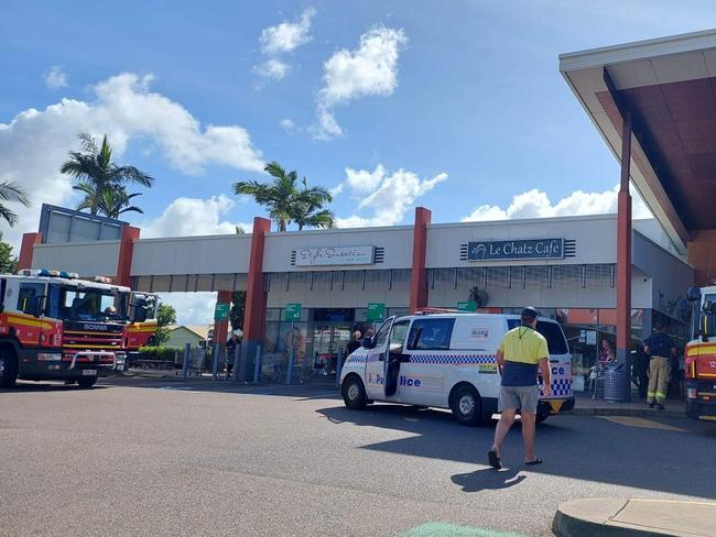 Police and firefighters at Woolworths The Avenues, Thuringowa, on Saturday.