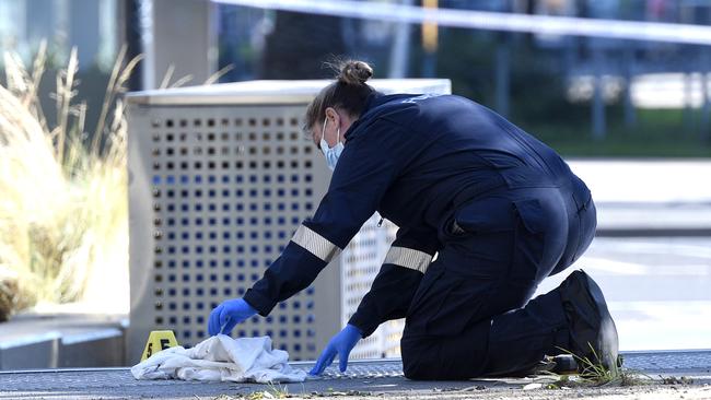 Police at the scene of a fatal stabbing in Bourke Street in Docklands. Picture: Andrew Henshaw