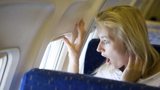 surprised girl in the airplane