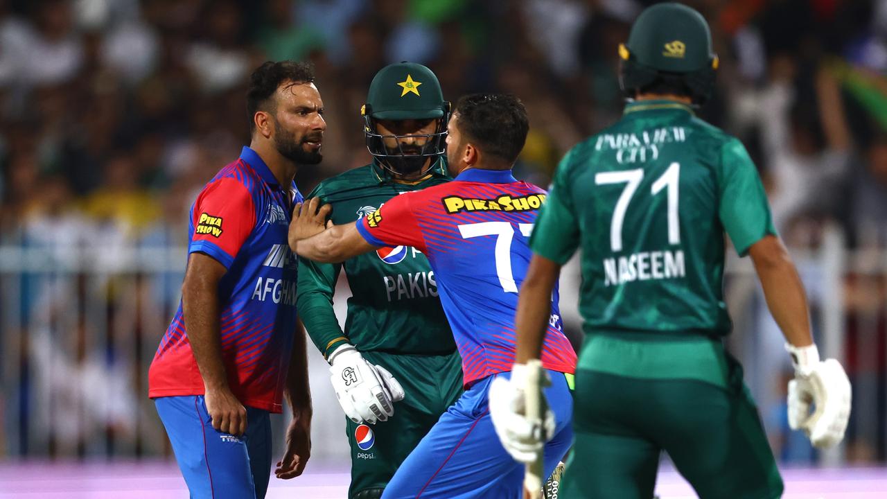 Fareed Ahmad of Afghanistan exchanges words with Asif Ali of Pakistan. Photo by Francois Nel/Getty Images