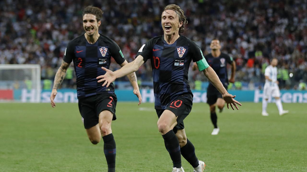Croatia's Luka Modric, right, celebrates with teammates after scoring his side's second goal against Argentina.