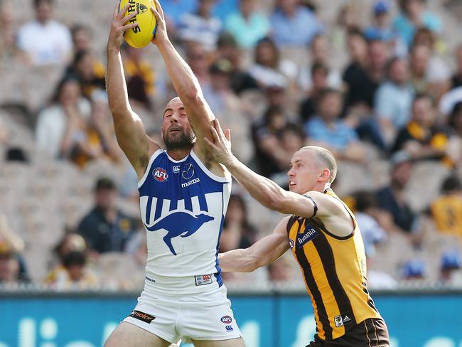 North Melbourne’s Ben Cunnington marks in front of Tom Scully. Picture: Michael Klein.