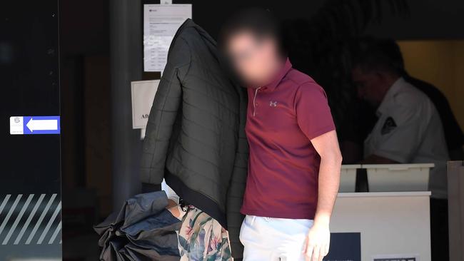 Sheryl Laine Arthur (left) covering her face while leaving Maroochydore Magistrates Court on Tuesday. Picture: Patrick Woods