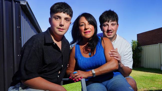 Christina Georgiades with her sons Timothy and George at their home in Melbourne's north-west. The secondary school teacher has written a book about her pregnancy struggles. Picture: Luis Ascui