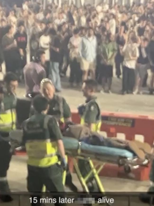 The fan was later taken away on a stretcher by medical staff. Picture: TikTok