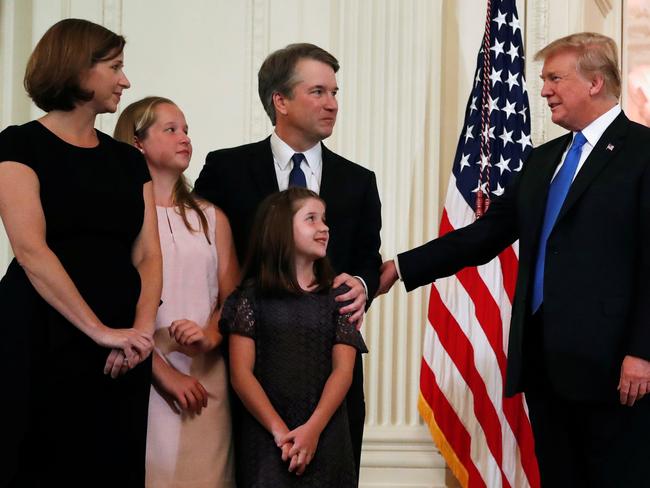 U.S. President Donald Trump talks to Supreme Court nominee judge Brett Kavanaugh, his daughters and his wife Ashley Estes Kavanaugh, in the East Room of the White House in Washington, U.S., July 9, 2018. REUTERS/Leah Millis - RC1B13DCF6E0