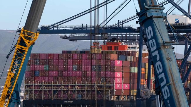 Hong Kong flagged container ship Seaspan Beacon is pictured at the port in Ensenada, Baja California state, Mexico on March 4, 2025. US President Donald Trump could announce a compromise tariff arrangement with Canada and Mexico on March 5, 2025, his commerce secretary said in an interview, shortly after sweeping 25-percent levies went into effect. (Photo by Guillermo Arias / AFP)