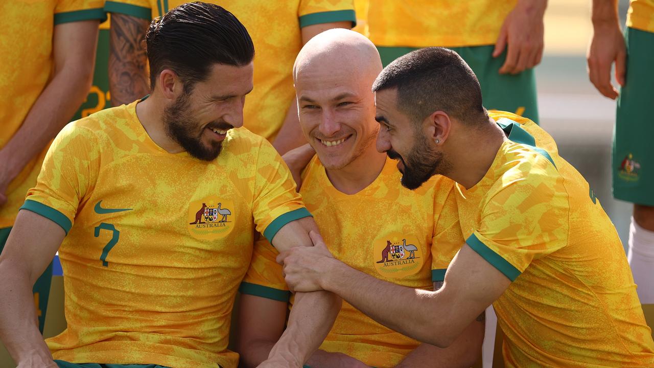 Mathew Leckie, Aaron Mooy and Aziz Behich of Australia are seen during the Australia Official Team Photo at Aspire Training Ground.