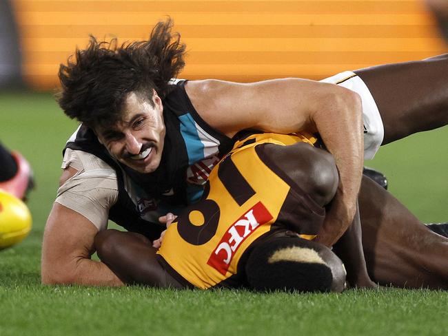 NCA. ADELAIDE, AUSTRALIA. September 13, 2024. AFL Semi Finals. Hawthorn vs Port Adelaide at the Adelaide Oval. Hawthorns Mabior Chol is tackled by Ports  Lachie Jones in the second quarter. Picture: Michael Klein