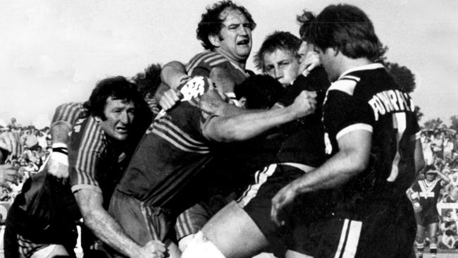 Tom Raudonikus (R) watches forward battle after he fed ball into the scrum during Wests v Parramatta first grade match at Lidcombe Oval, Auburn in Sydney, 30/07/78 (1978). Pic Warwick Lawson.