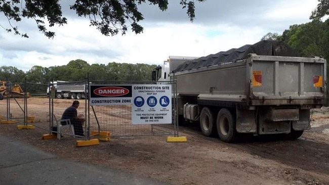 Workers at Black Swan Lake on the Gold Coast.