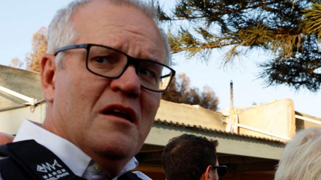 Former British Prime Minister Boris Johnson and former Australian Prime Minister Scott Morrison visit Kibbutz Kfar Aza following the October attack by Hamas gunmen from the Gaza Strip, in southern Israel, November 5, 2023. REUTERS/Evelyn Hockstein