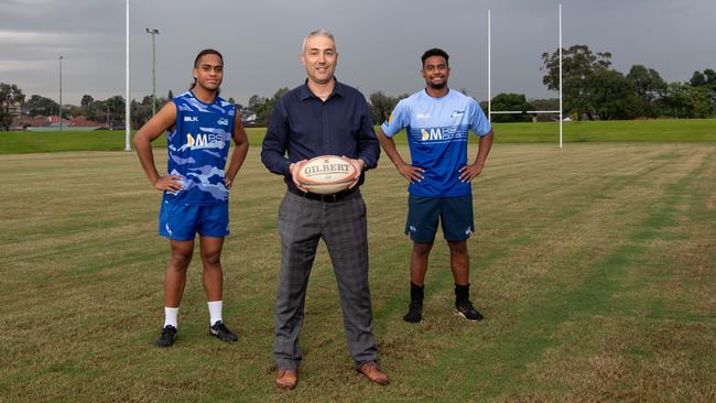 Two Blues players Zebulun Kavapalu and Norwin Latu with Cumberland Mayor Steve Christou test the pitch. Picture: Monique Harmer