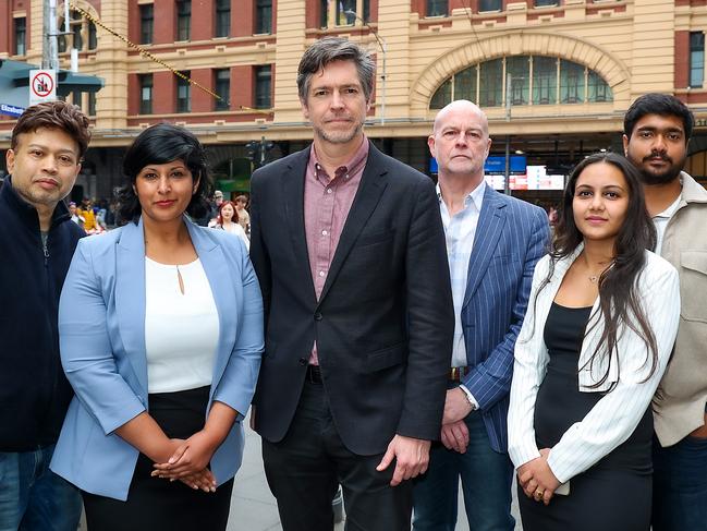 Lord Mayor Nick Reece (centre) and Deputy Lord Mayor Roshena Campbell (second from left) with Elizabeth St traders.