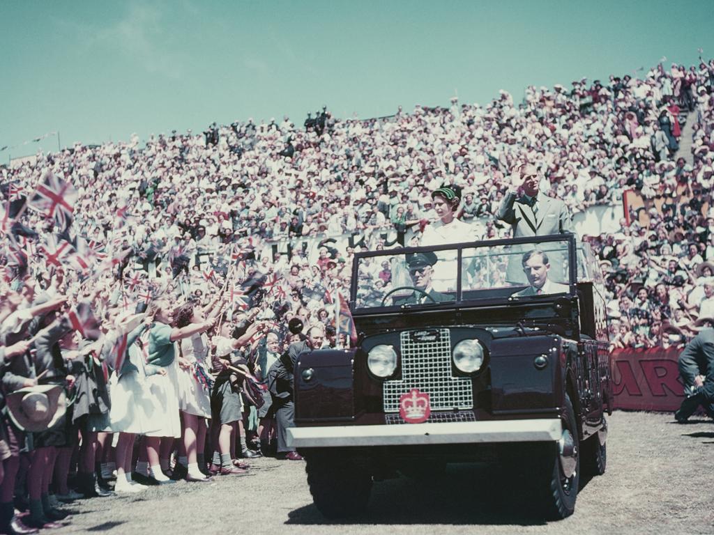 Queen Elizabeth II and Prince Philip wave to the crowd while on their Commonwealth visit to Australia, 1954. Picture: Fox Photos/Hulton Archive/Getty Images