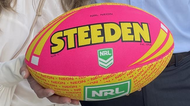 Wholesale bakery business Jean-Pierre CEO Sylvie Danoy with Townsville MP Adam Baille with a Women in Manufacturing Round game ball.
