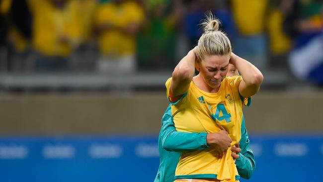 Australia’s Alanna Kennedy is embraced after missing the decisive penalty.
