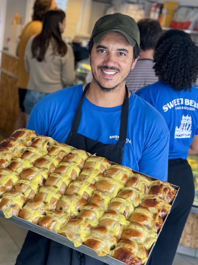 Sweet Belem Cake Boutique chef/owner Jose Silva with tray of hot cross buns. Picture: Jenifer Jagielski