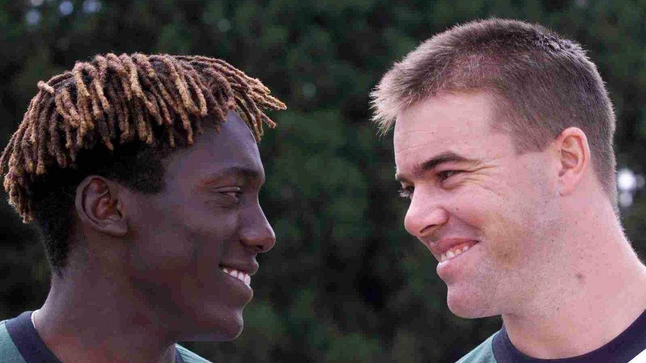 Former Zimbabwe cricketers Henry Olongo (L) and Heath Streak in 1999.