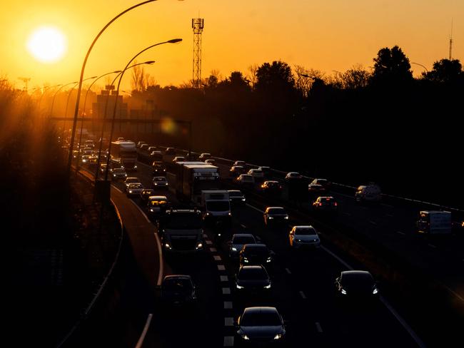 This photograph shows cars in a heavy traffic as the sun rise on the road ring (peripherique) in Toulouse, southwestern France on February 6, 2025. (Photo by Lionel BONAVENTURE / AFP)