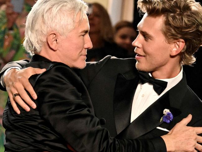 Australian director Baz Luhrmann hugs US actor Austin Butler following the screening of "Elvis" during the 75th edition of the Cannes Film Festival. Picture: LOIC VENANCE / AFP