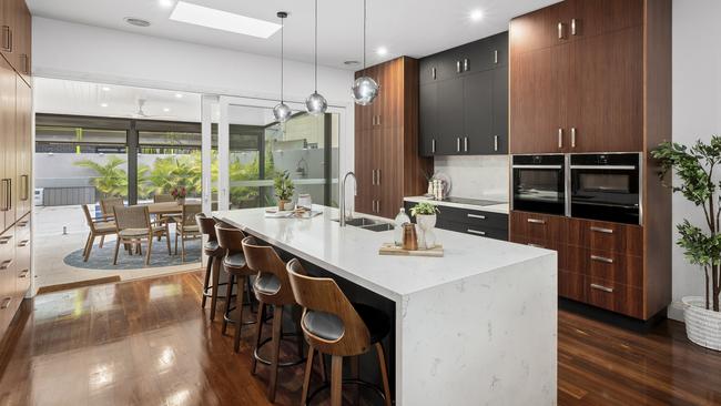 Ample cupboards have been included in the kitchen design.