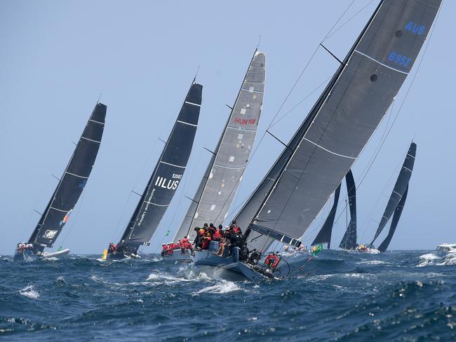 The fleet leaves the heads at the start of the Sydney to Hobart Yacht race in Sydney, Thursday, December 26, 2019. (AAP Image/Dan Himbrechts) NO ARCHIVING, EDITORIAL USE ONLY