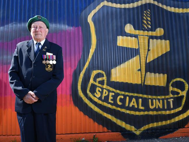 Mervyn Fox with a mural near his Adelaide home