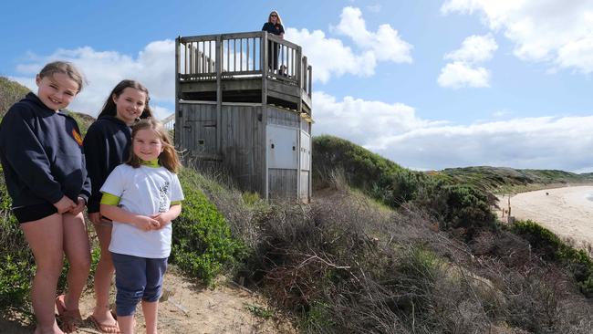 President Lisa Happ on the lookout on top of the tower and Nippers Mary, 8, Winnie, 10, and Eloise, 7. Picture: Mark Wilson