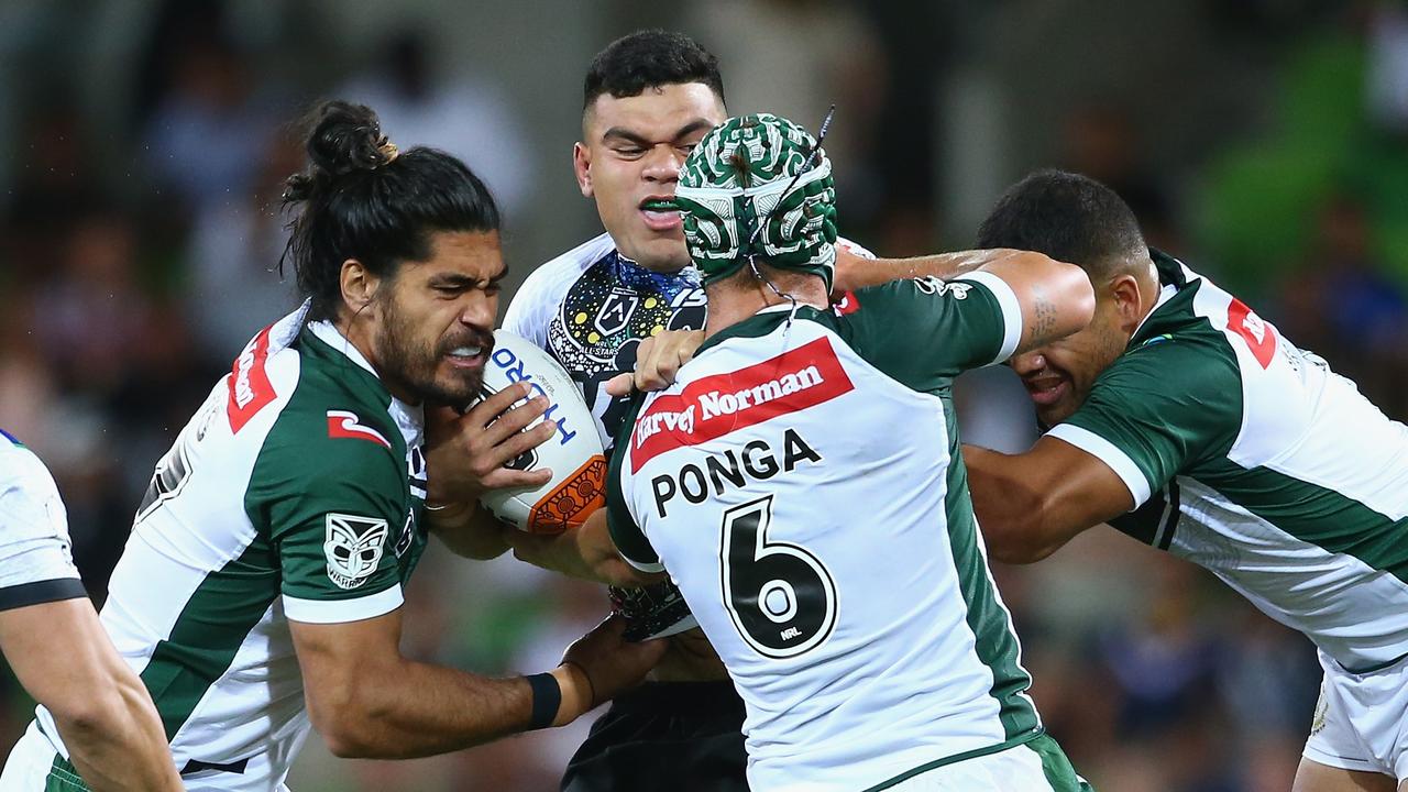 David Fifita of Indigenous Man's All Stars is tackled by Kalyn Ponga and teammates.